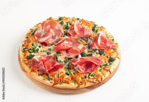 Pizza with prosciutto, ham, arugula, spinach, tomatoes, pesto, cheese and parmesan. Italian cuisine. 