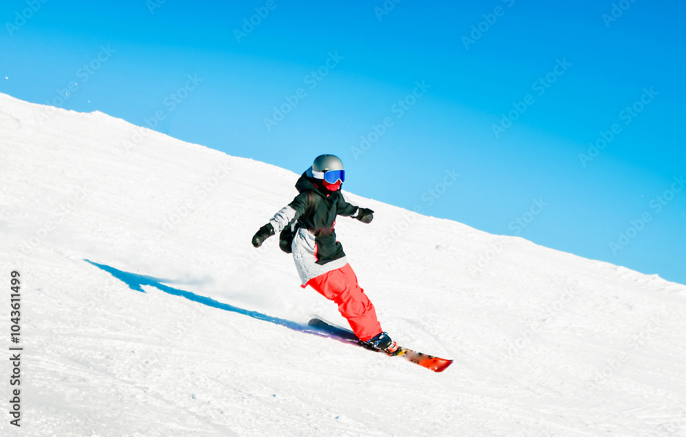 Dynamic picture of woman skier wear black red winter sport wear isolated on piste ski downhill fast motion in Alps. Active winter holidays, skiing downhill in overcast day. Ski rides on the track Dynamic picture of woman skier wear black red winter sport wear isolated on piste ski downhill fast motion in Alps. Active winter holidays, skiing downhill in overcast day. Ski rides on the track
