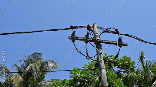 Ugly electric wires on busy road in Mauritius.