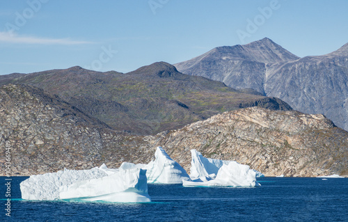 View of montains and icebergs from Uunartoq island (South Greenland) photo