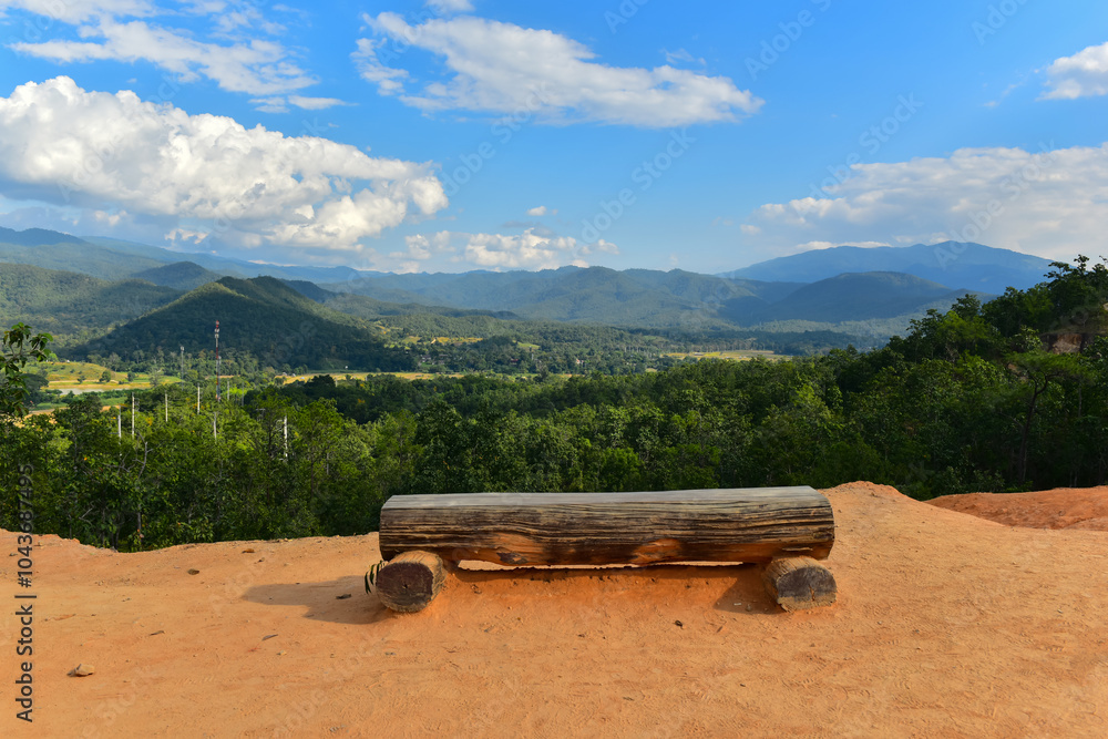 wooden stump chair with view of the mountains wooden stump chair with view of the mountains