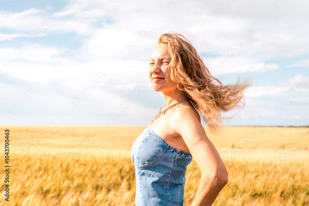 Russia, Republic of Tatarstan, Kalmash village, August 01, 2024, 17:00, girl in a dress in a wheat field in summer Russia, Republic of Tatarstan, Kalmash village, August 01, 2024, 17:00, girl in a dress in a wheat field in summer