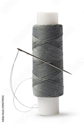 Bilde på lerret Thread bobbin and needle on white background