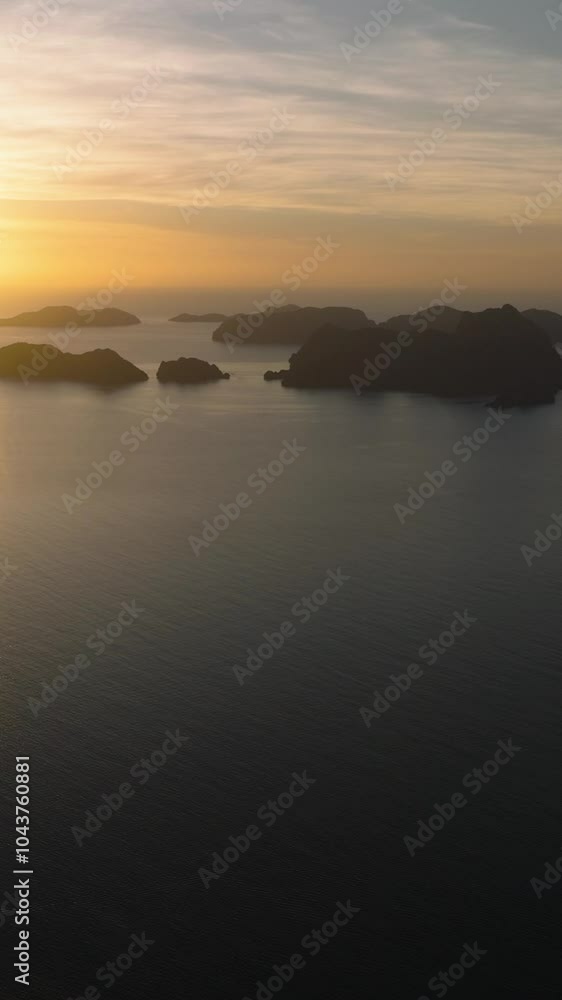 Aerial drone of Sunset over the Islands in El Nido. Palawan. Philippines. Vertical view. Aerial drone of Sunset over the Islands in El Nido. Palawan. Philippines. Vertical view.