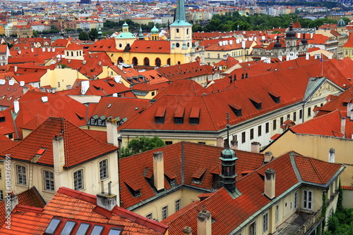 Prague, Czech Republic. Mala Strana, Lesser Town of Praha. Top view, panorama. Ancient old house with red tiled roofs, church, tower