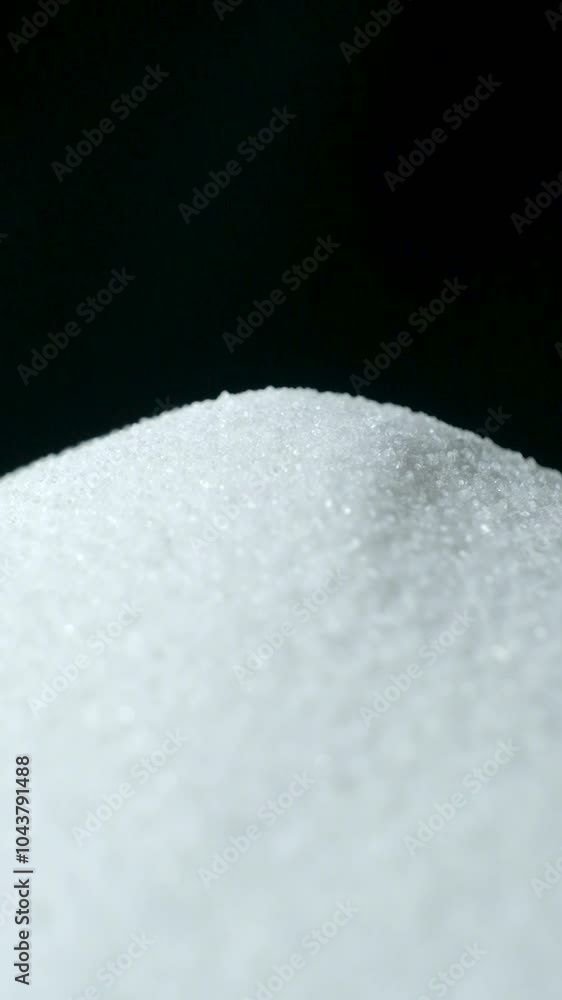 Slow Rotation of Finely Ground White Rock Salt, Black Background, Vertical Shooting. Slow Rotation of Finely Ground White Rock Salt, Black Background, Vertical Shooting.