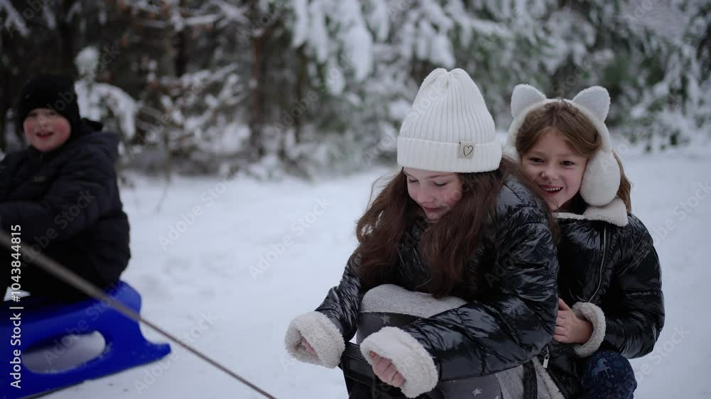 Children playing in snow with sleds. Concept of winter joy. Children playing in snow with sleds. Concept of winter joy.