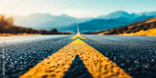 Asphalt Road Symbolism, Long, asphalted road with upward arrows. Symbolizes growth, development, success.Ideal for themes of progress, ambition, and continuous improvemen photo