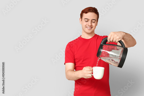 Handsome young man pouring ...