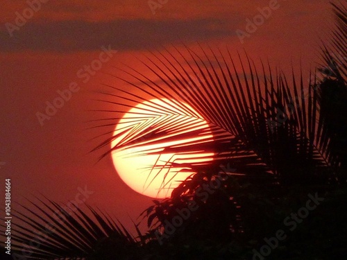 Here's a photo of the sun setting and a zoomed-in photo showing the sun getting bigger.
