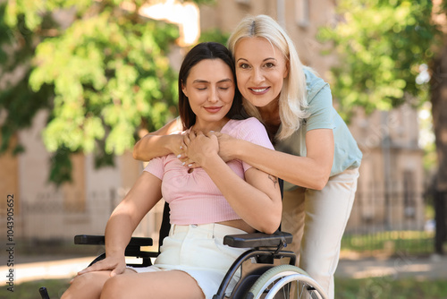 Young woman in wheelchair a...