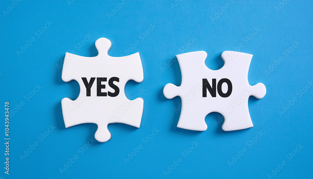 Two white puzzle pieces with text YES and NO. Decision making, two choices. Blue backdrop. Close-up Two white puzzle pieces with text YES and NO. Decision making, two choices. Blue backdrop. Close-up