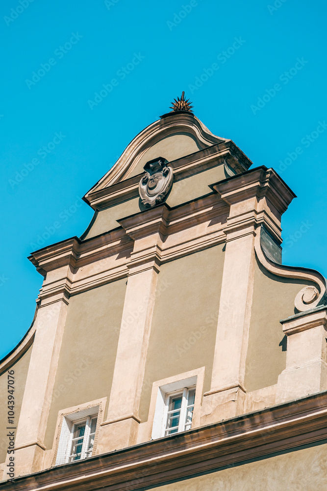 Colorful Historic Buildings and Houses on Stary Rynek Square in Poznań, Poland, with a Blue Sky and Mural Art