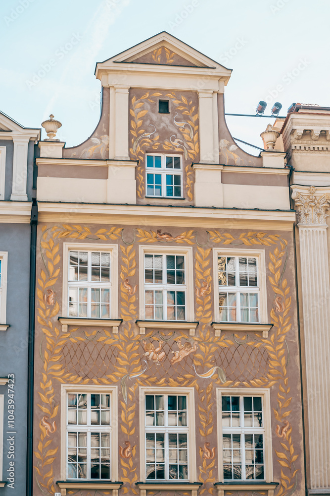 Colorful Historic Buildings and Houses on Stary Rynek Square in Poznań, Poland, with a Blue Sky and Mural Art