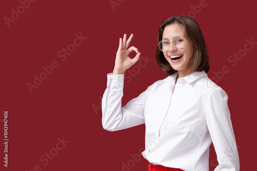 Pretty young woman showing ...