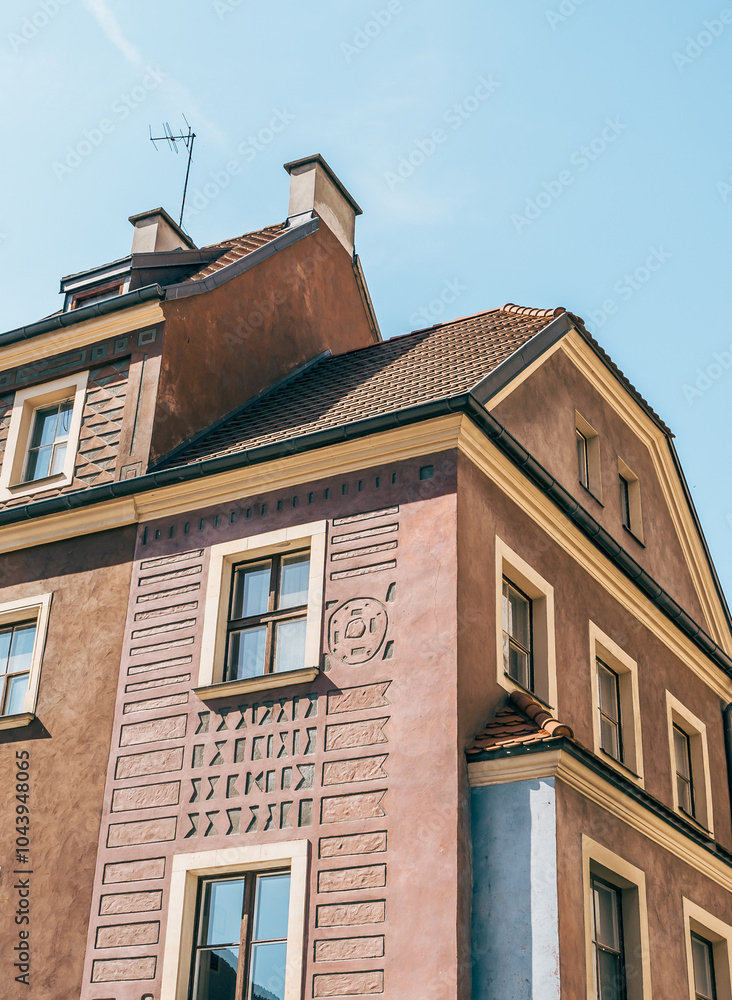 Colorful Historic Buildings and Houses on Stary Rynek Square in Poznań, Poland, with a Blue Sky and Mural Art