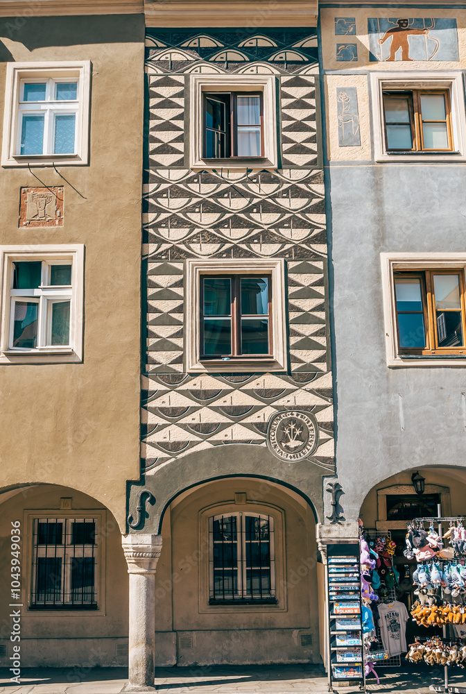 Colorful Historic Buildings and Houses on Stary Rynek Square in Poznań, Poland, with a Blue Sky and Mural Art