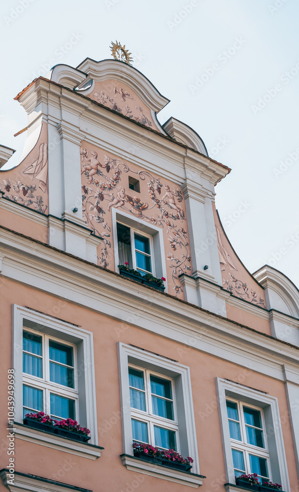 Colorful Historic Buildings and Houses on Stary Rynek Square in Poznań, Poland, with a Blue Sky and Mural Art