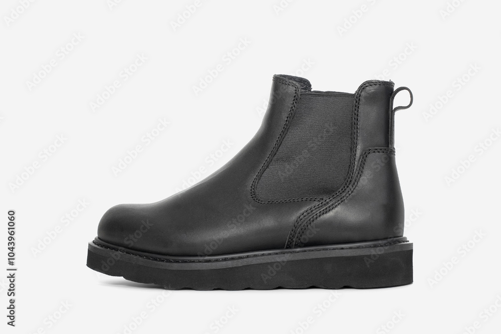 Black leather boots on white background. Fashion Black leather boots on white background. Fashion