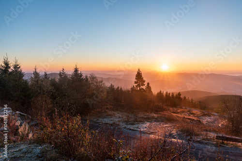 Sunrise from Lysa hora hill in Moravskoslezske Beskydy mountains in Czech republic photo