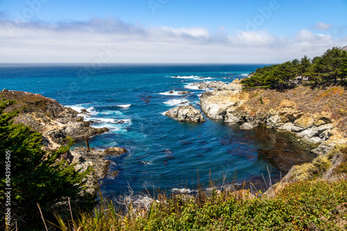 The stunning view at Kasler Point Lookout in Big Sur, California, where the rugged coast meets the vast Pacific Ocean. photo