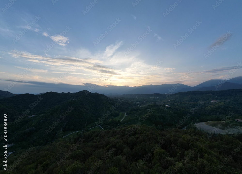 Obraz premium aerial view of the Prosecco hills landscape under a clear sky at sunset in Treviso, Veneto, Italy