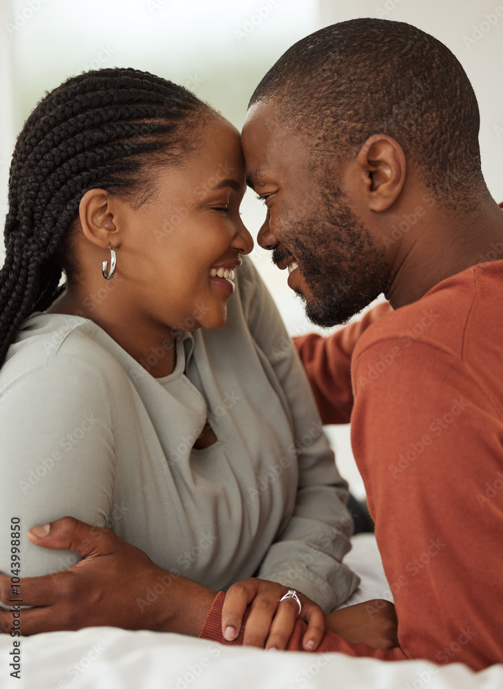 Obraz premium Black couple, forehead and touch with love in bedroom for embrace, bonding together and marriage loyalty. Smile, people and morning romance with partner, healthy relationship and commitment at house