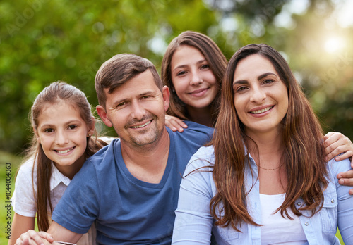 Parents, children and smile in portrait at park for holiday, relax and relationship with love in nature. Happy family, people and girl kids outdoor for weekend together, safety and support with care