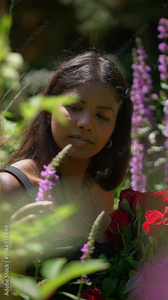 A Captivating and Enchanting Young Woman Posing Gracefully in a Lush Flower Garden A Captivating and Enchanting Young Woman Posing Gracefully in a Lush Flower Garden