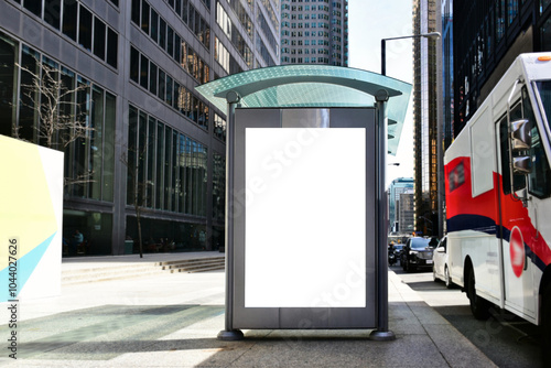 bus shelter with blank ad panel. billboard display. empty white lightbox sign at bus stop. billboard mockup. glass structure. city transit station. North American urban street. outdoor advertising.