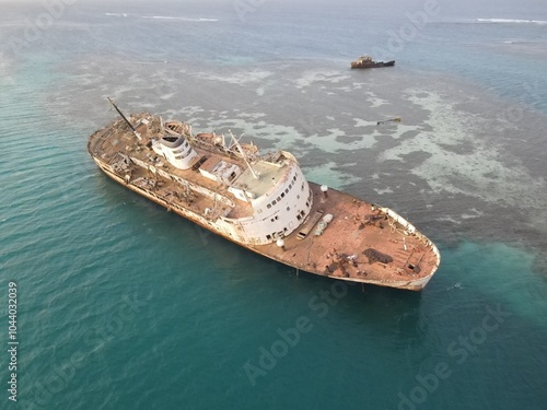 Sunken rusted ship in abu shawk meccah province, Saudi Arabia photo