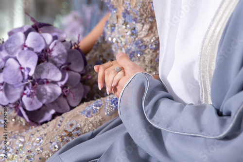 Woman holding the hands of her man during engagement ceremony photo