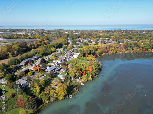 Aerial over Martindale Pond near Henley Island viewing north towards Port Dalhousie and Lake Ontario in St. Catharines, Ontario, Canada on a sunny Autumn day in October, 2024.