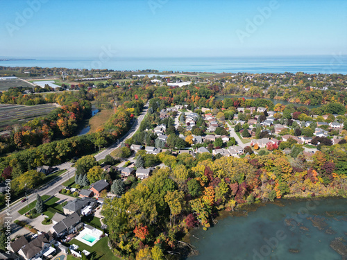 Aerial over Richardson's Creek and Port Dalhousie area viewing northwest from Martindale Pond near Martindale and Lake Ontario in north St. Catharines, Ontario, Canada on a sunny Autumn day in October