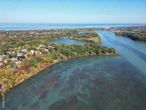 Aerial over Martindale Pond viewing north towards Henley Island, Port Dalhousie and Lake Ontario in St. Catharines, Ontario, Canada on a sunny Autumn day in October, 2024.
