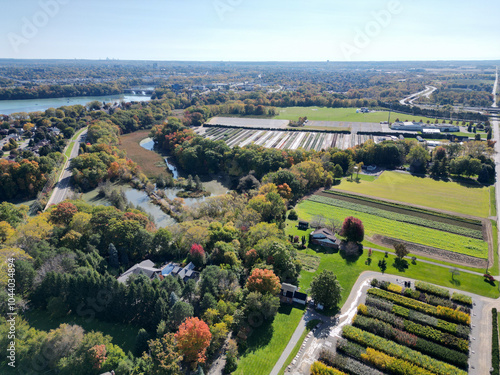 Aerial over Martindale, suburban and agricultural area of north St. Catharines, Ontario, Canada and Martindale Pond near the Port Dalhousie area, viewing southeast from Louth on a sunny Autumn day.