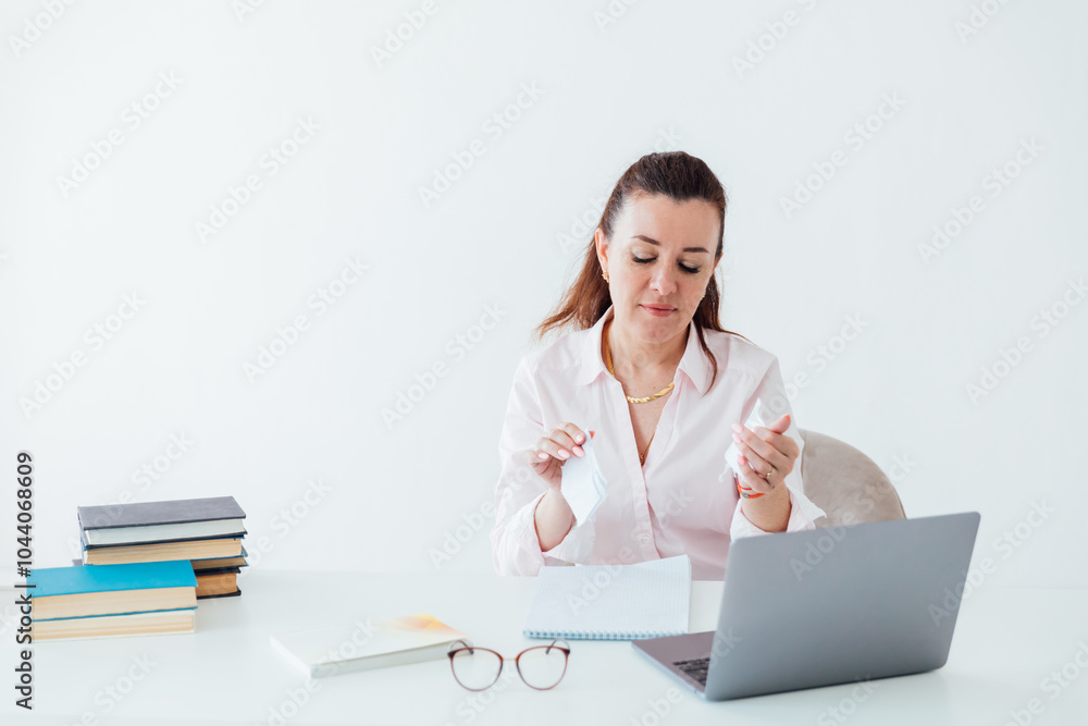 Business woman working online with laptop at desk in office Business woman working online with laptop at desk in office