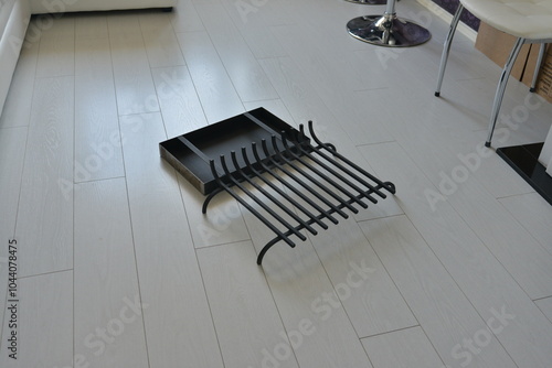 A subject photo shoot of black grilles for fireplaces.