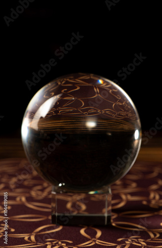 Crystal ball, scene with crystal ball and smoke, dark background. Selective focus.