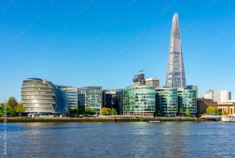 Shard skyscraper and City Hall building in Southwark along Thames river, London, UK