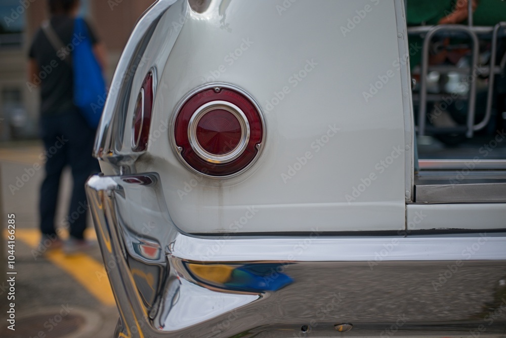 Fototapeta premium Close-up of Vintage Car Tail Light and Bumper