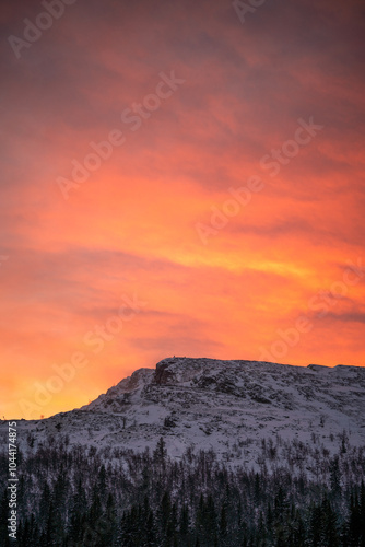 red dramatic skies with mountain scenery during winter photo