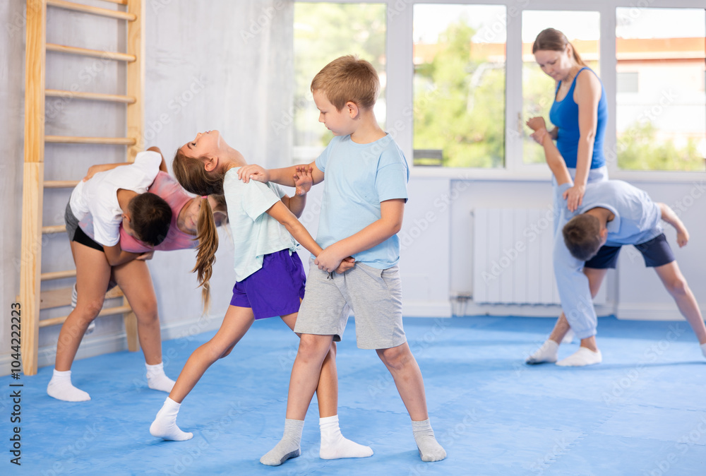 Fototapeta premium Children are focusing on their hand grip techniques to develop better control and power