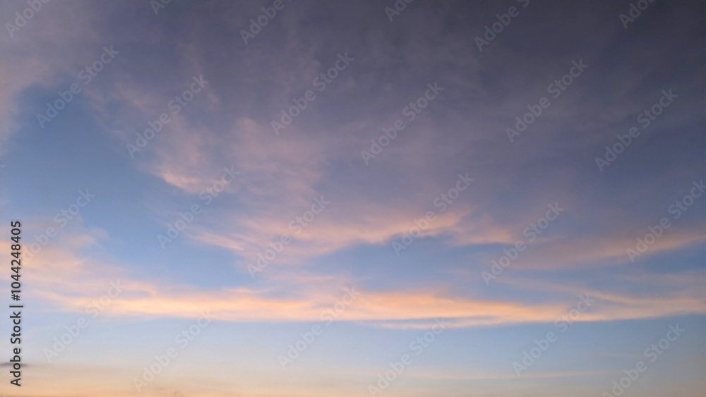 A beautiful sunset sky with shades of pink, purple, and orange. The clouds are wispy and form interesting patterns. The horizon is barely visible, blending into the sky. A beautiful sunset sky with shades of pink, purple, and orange. The clouds are wispy and form interesting patterns. The horizon is barely visible, blending into the sky.