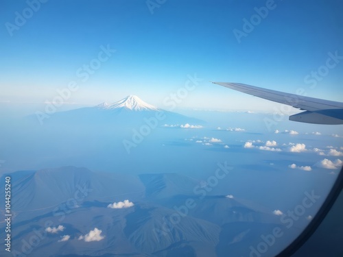 A plane window is seen from inside an airplane
 photo