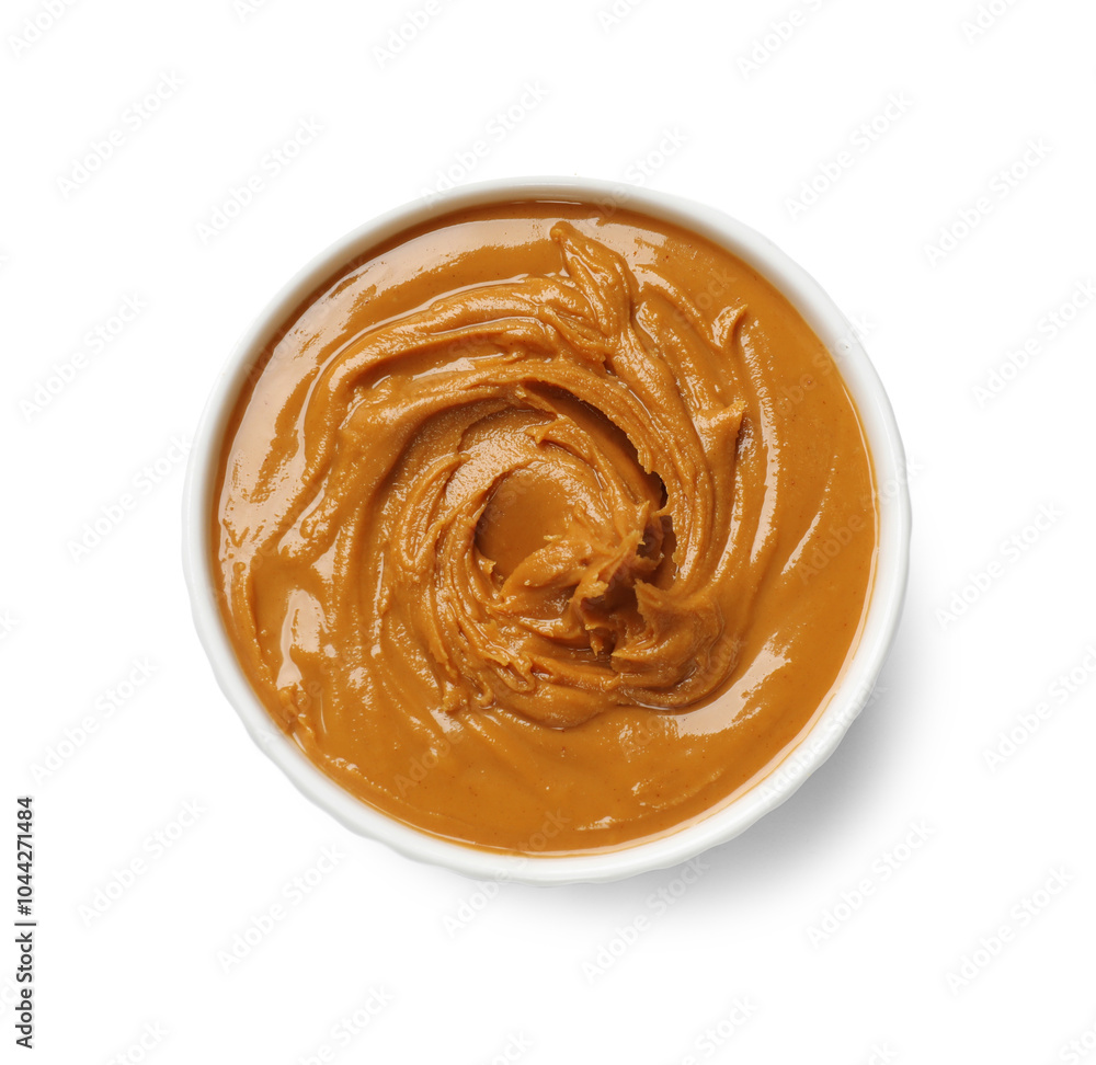 Tasty peanut butter in bowl isolated on white, top view Tasty peanut butter in bowl isolated on white, top view