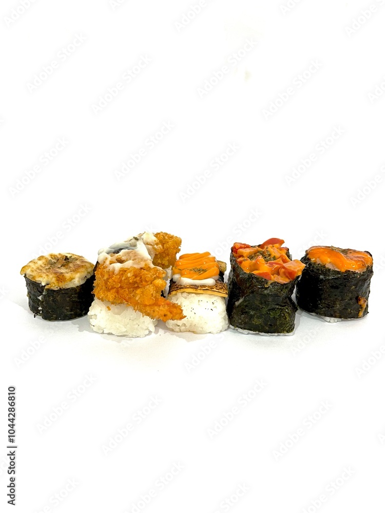 Assorted sushi nigiri and maki row set isolated on white background. A variety of Japanese sushi with tuna, crab, shrimp, cheese and katsu. Assorted sushi nigiri and maki row set isolated on white background. A variety of Japanese sushi with tuna, crab, shrimp, cheese and katsu.
