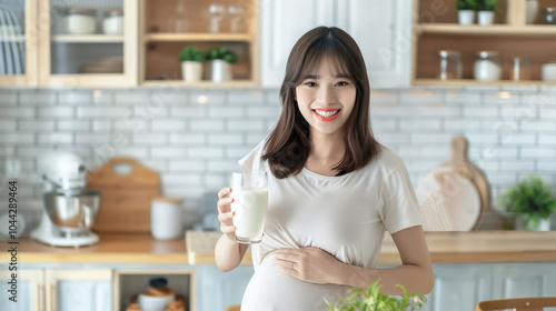 Smiling Asian Pregnant Woman Holding Glass Milk Kitchen