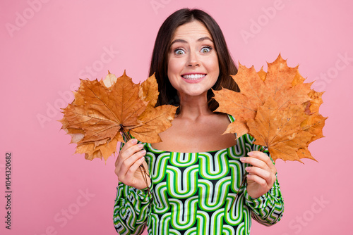 Photo of charming adorable cheerful woman wear green trendy clothes hold bouquet dry leaves isolated on pink color background