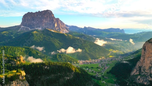 Wide agnle shot of a valley nestled within a mountainous region photo